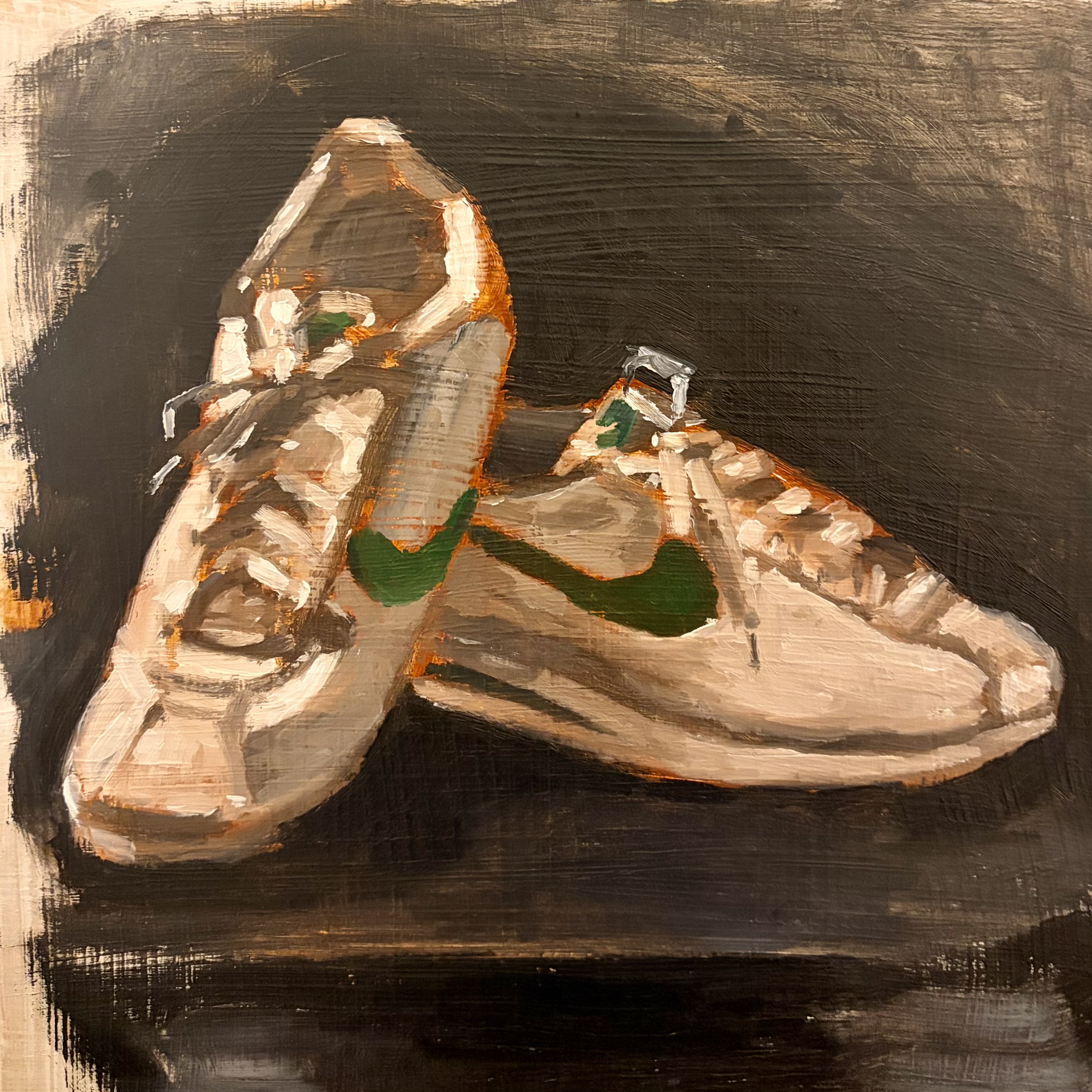 Oil painting of a pair of sneakers on a dark surface.